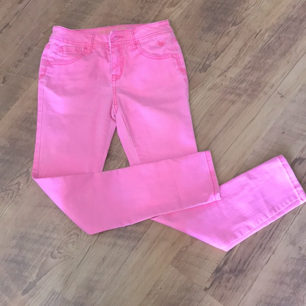Girls Justice neon pink jeans.